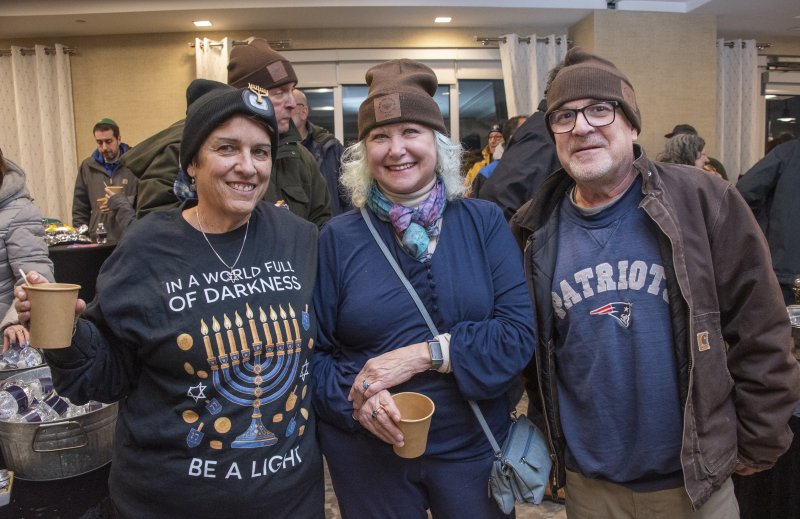 Leslie Cain, Anna Toyna and Chuck Coffman (l-r) gathered to share the light.